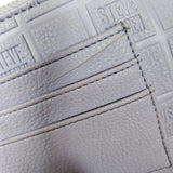 bolso de mano / cosmetiquero lila pastel steve madden