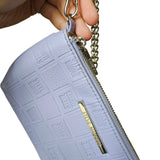 bolso de mano / cosmetiquero lila pastel steve madden